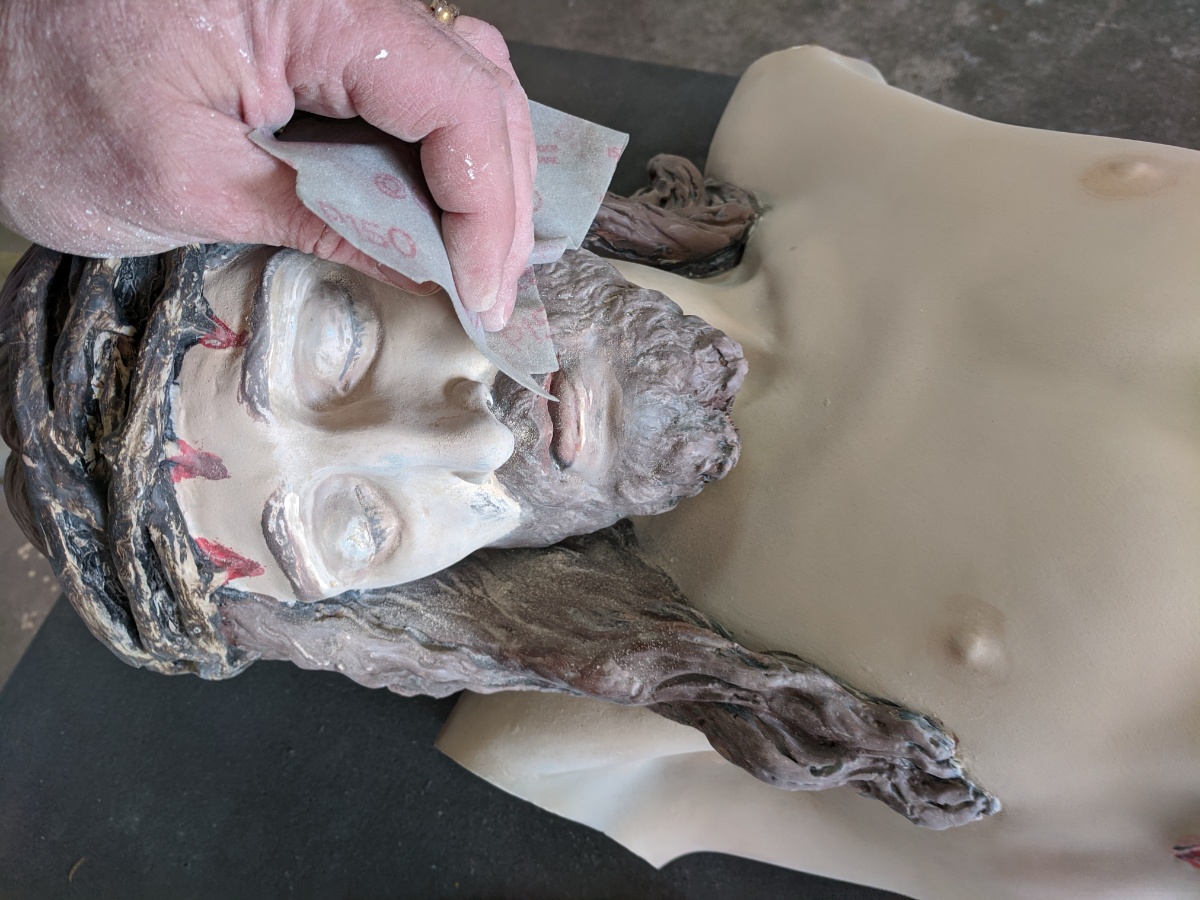 Sanding Statue of Jesus